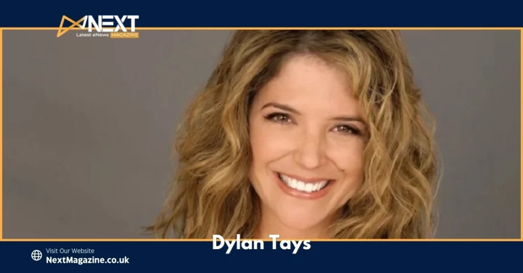 Dylan Tays with wavy blonde hair against a neutral background.