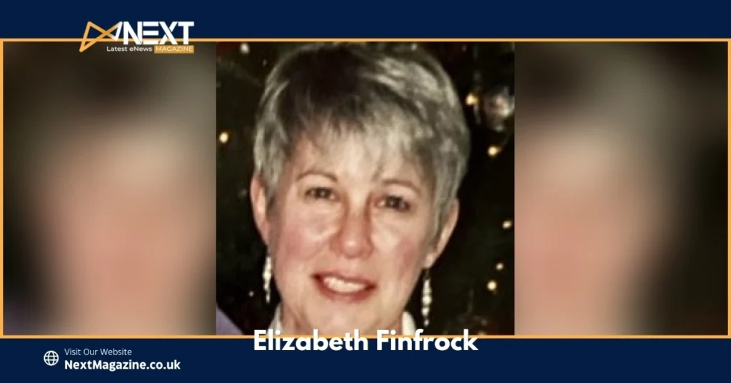 Elizabeth Finfrock smiling in a close-up portrait with short gray hair, wearing earrings, featured on NextMagazine.co.uk.