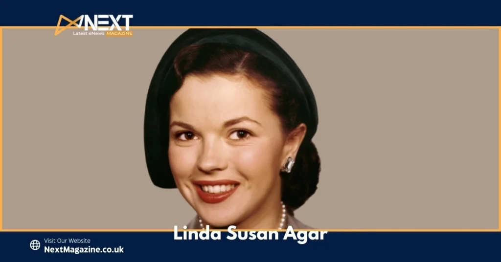 Portrait of Linda Susan Agar smiling in a classic dark green outfit and pearl accessories, showcasing her elegance and grace.