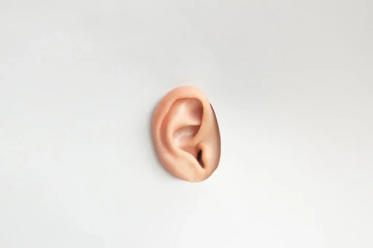 Close-up of an ear symbolizing sound quality improvement with Addictive Sound acoustic panels.