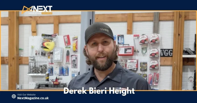 Derek Bieri standing in his Vice Grip Garage workshop, smiling with tools and automotive equipment behind him.