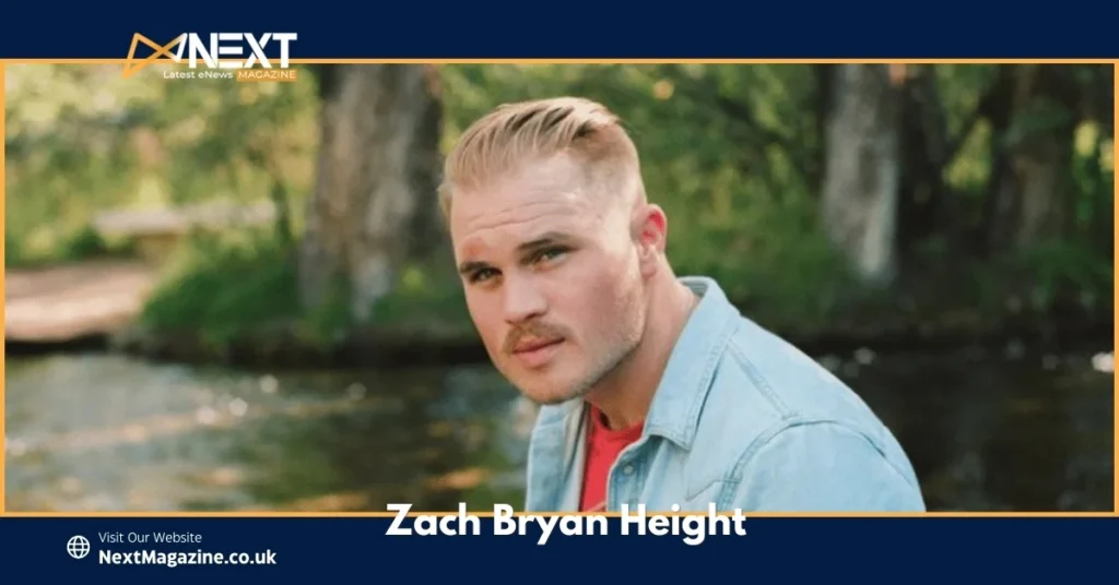Close-up of Zach Bryan Height a denim shirt, sitting near a creek, with a confident gaze reflecting his rugged, laid-back country style.