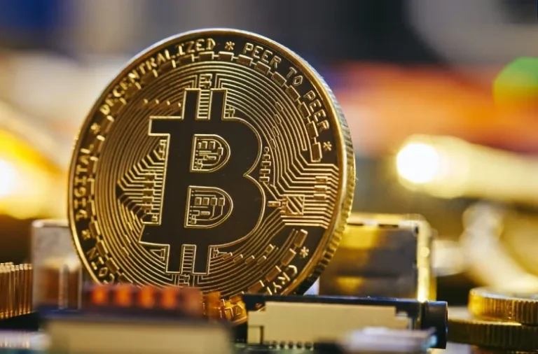 Bitcoin coin on a circuit board representing cryptocurrency use in online gambling.