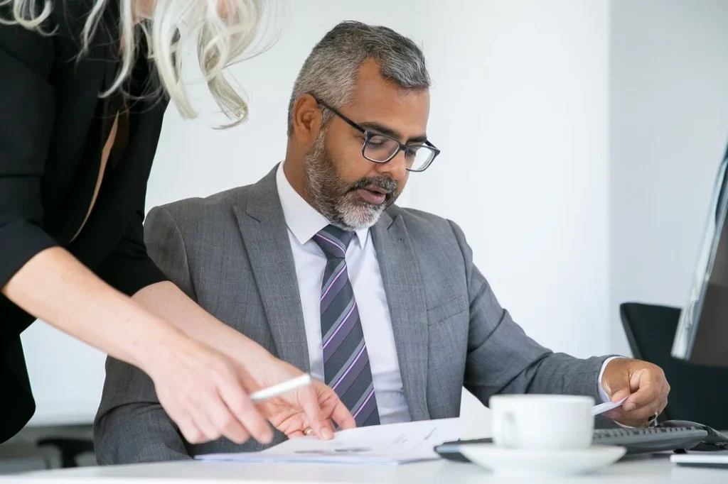 An experienced injury attorney reviewing legal documents to help accident victims get fair compensation.