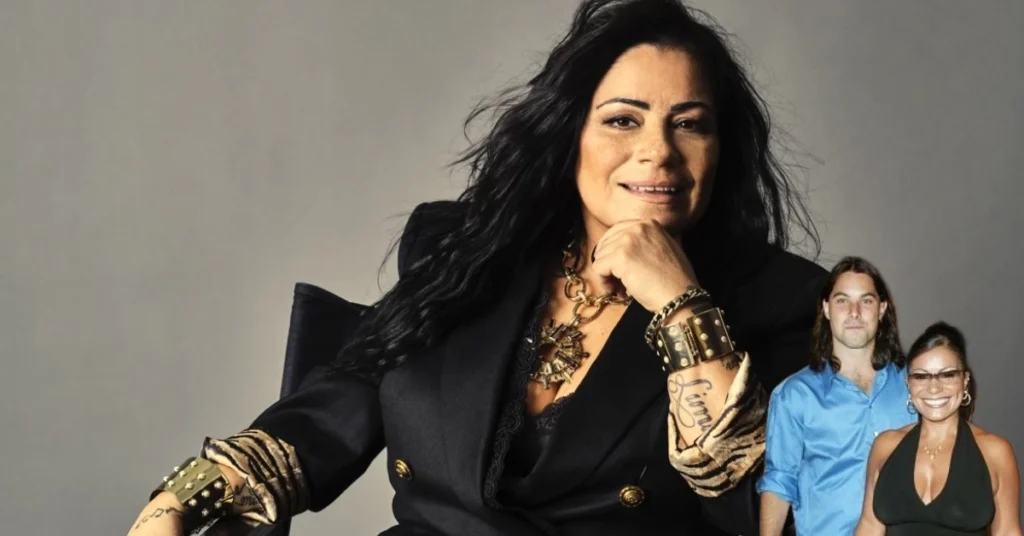 Lisa Lisa posing in black clothing with gold jewelry, potentially with Antonimar Mello in the background at a photo session