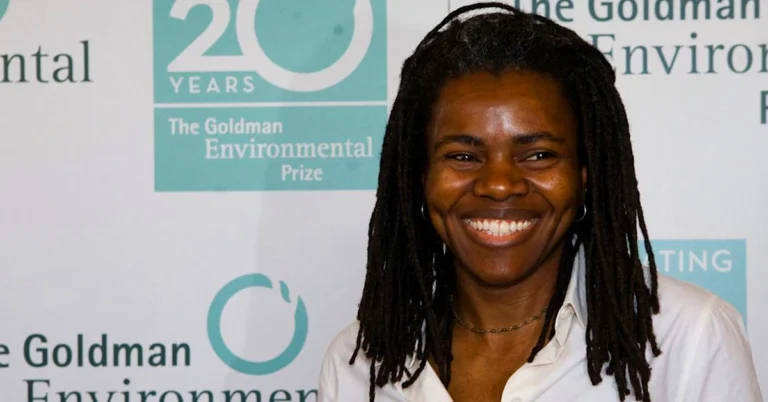 Aneta Chapman smiling at Goldman Environmental Prize event, wearing white shirt with dreadlocks
