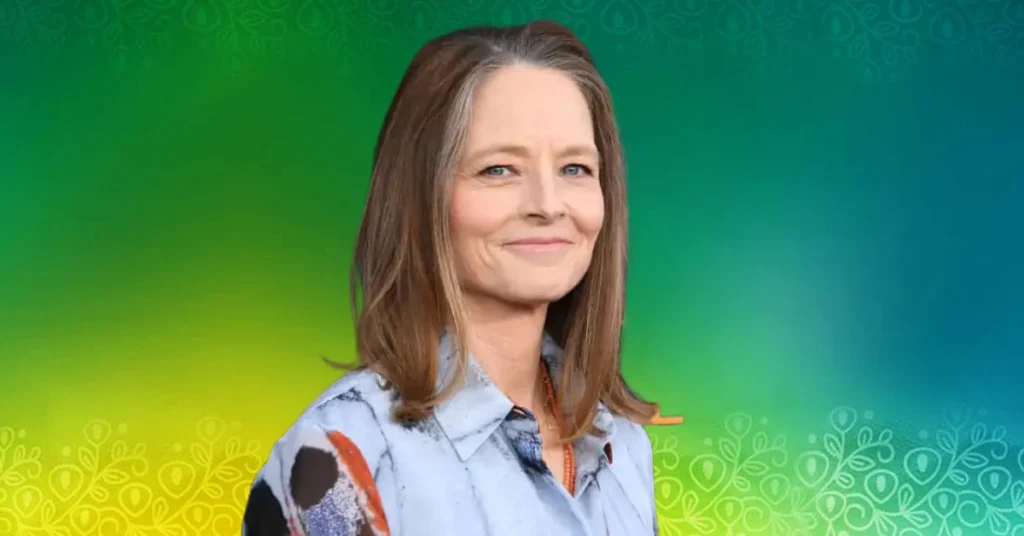 Sydney Bernard film producer smiling in professional portrait against colorful background