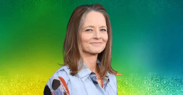Sydney Bernard film producer smiling in professional portrait against colorful background