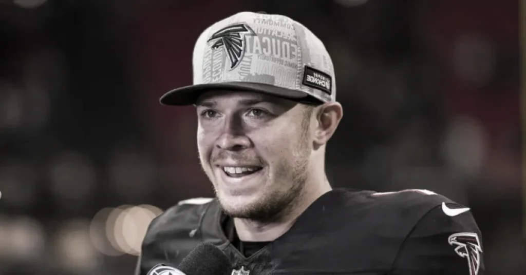 Taylor Heinicke smiling in Atlanta Falcons uniform celebrating his NFL success and growing net worth
