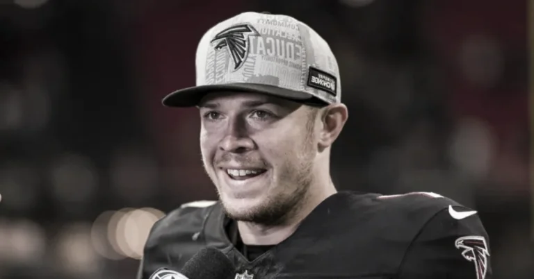 Taylor Heinicke smiling in Atlanta Falcons uniform celebrating his NFL success and growing net worth