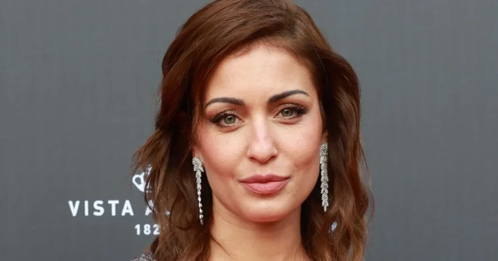 Hiba Abouk net worth Spanish actress red carpet elegant earrings professional photo