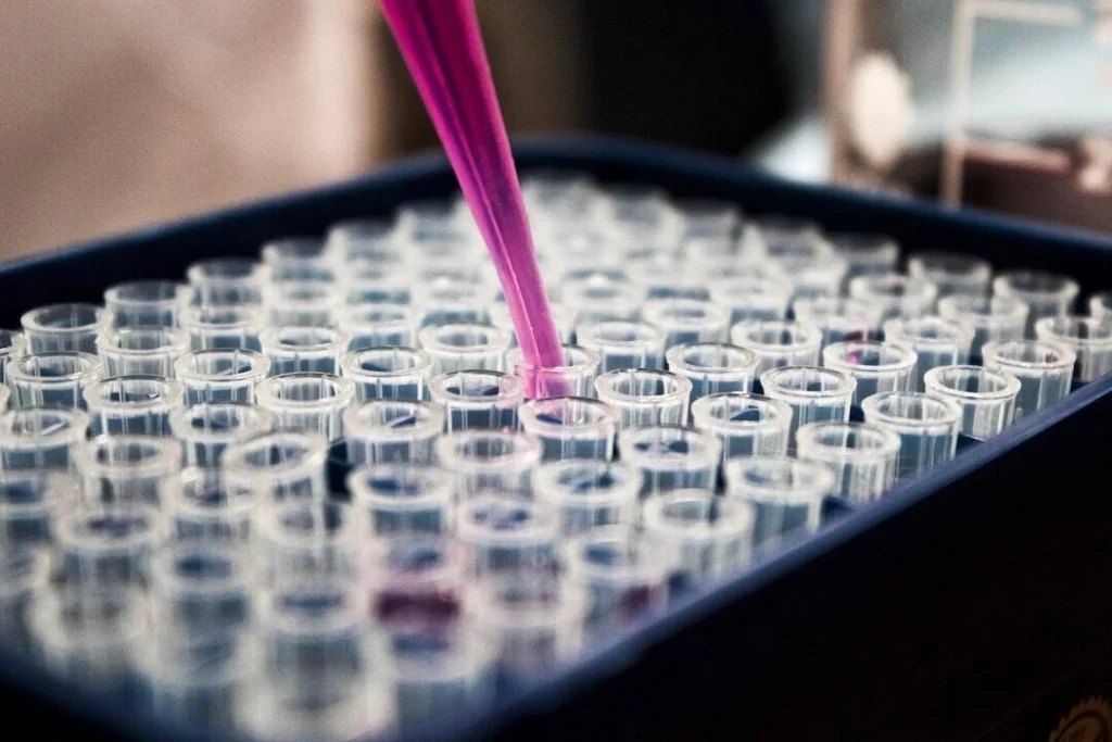 A scientist using advanced technology tools to conduct preclinical research in a modern lab