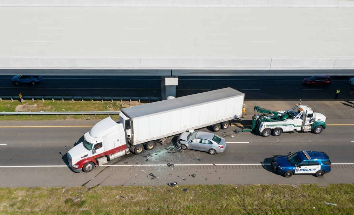 Truck Accident Attorney: How the Right Legal Help Protects Your Claim - News - Next Magazine Highway accident scene showing a truck and car involved in a crash